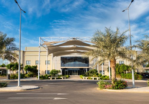 Alriyada College campus building showing the founding location